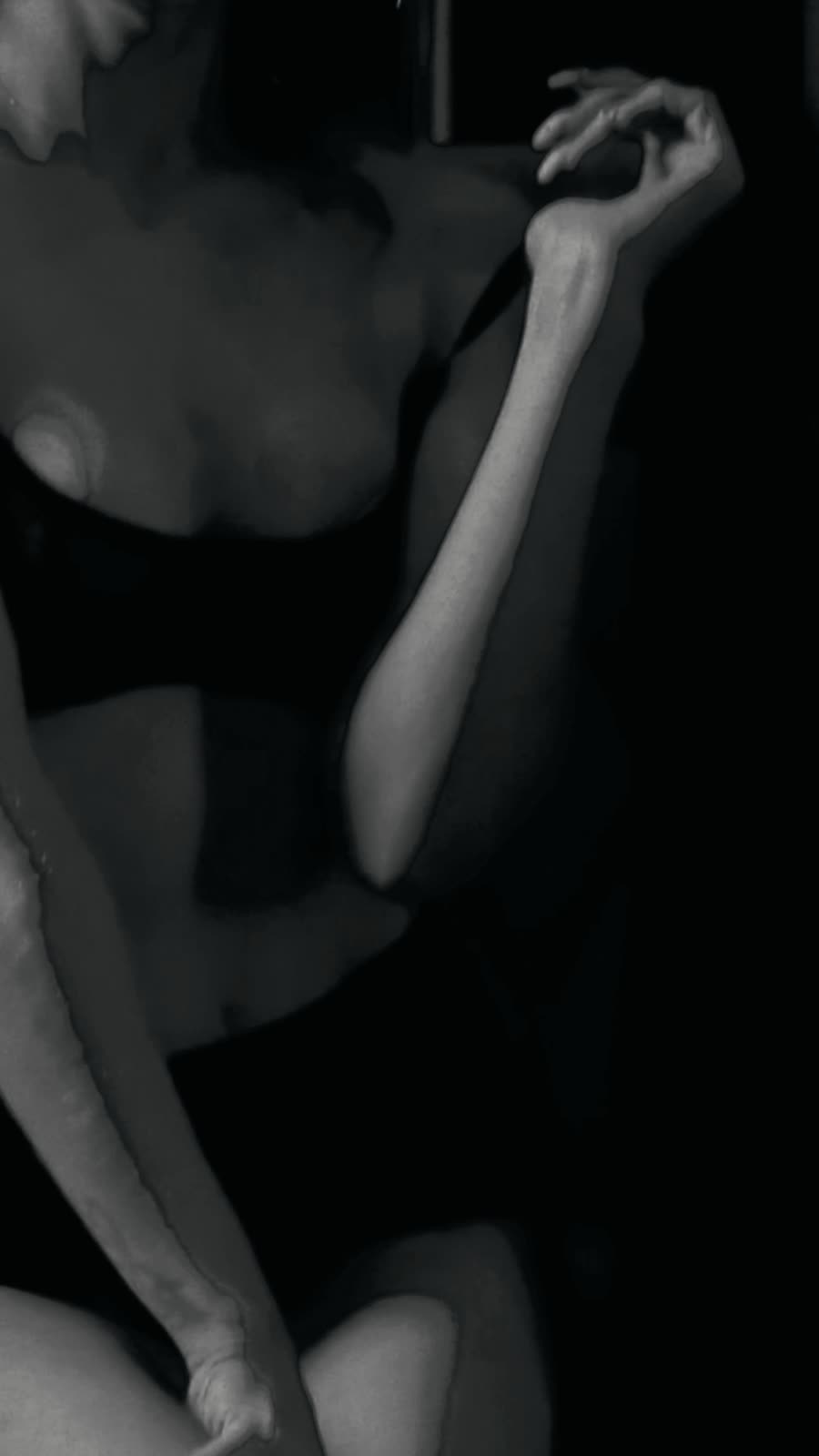 Gia in black and white, expressive gestures and sculptural light.