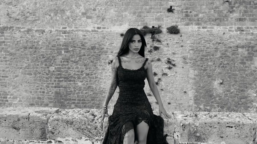 A black-and-white portrait of Lara.